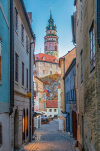 Street amidst buildings in city against sky