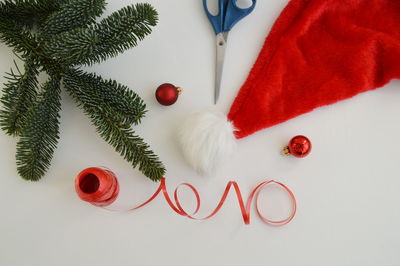 Directly above shot of christmas decoration on white table