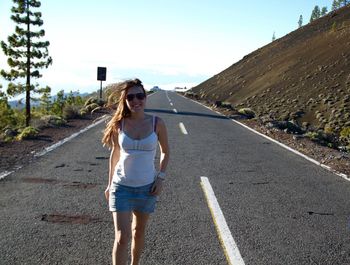 Woman walking on road