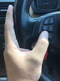 Midsection of man in car