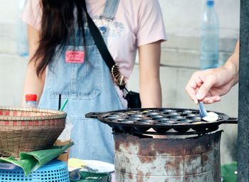 Midsection of woman preparing food