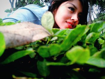 Close-up portrait of smiling young woman