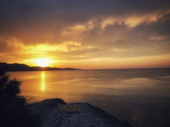 Scenic view of sea against sky during sunset