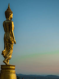 Statue of buddha against sky