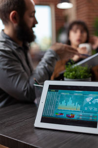 Young man using laptop at table