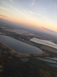 Aerial view of city at sunset