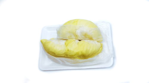 High angle view of lemon slice against white background