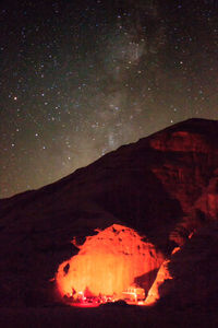 Scenic view of fire against sky at night