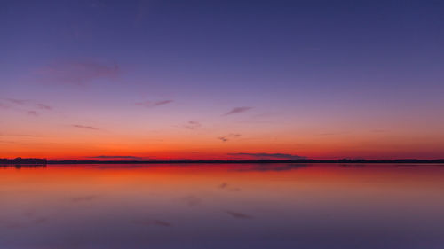 Scenic view of lake at sunset