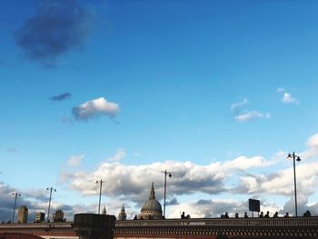 Low angle view of buildings against blue sky