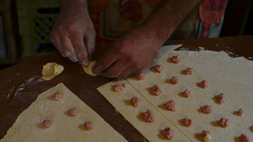 High angle view of person preparing food on table