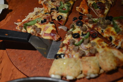 High angle view of fresh pizza with spatula