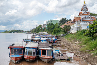 Boats moored in river