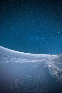 Digital composite image of airplane in sky at night