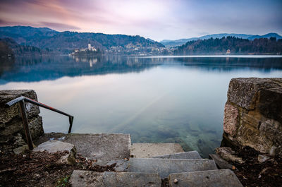 Scenic view of lake and mountains against sky