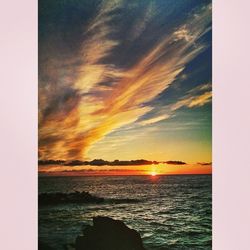 Scenic view of sea at sunset