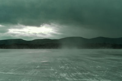 Scenic view of mountains against sky during winter