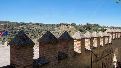 View of buildings against blue sky