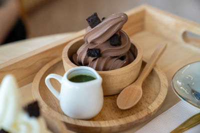 Close-up of chocolate icecream and green tea sauce on table
