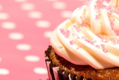 Cropped image of cupcake on table