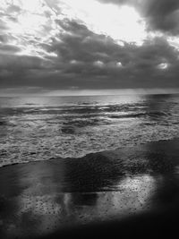 Scenic view of sea against cloudy sky