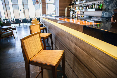 Empty chairs and table in restaurant