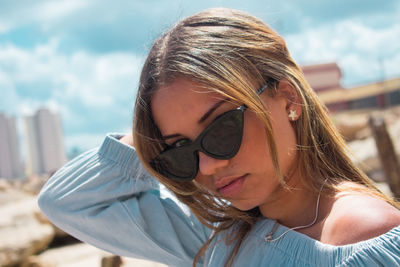 Portrait of young woman wearing sunglasses