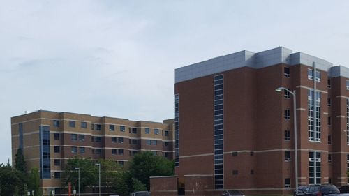 View of residential buildings against sky