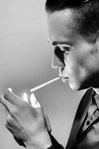 Young man smoking cigarette