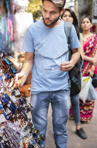Man looking sunglasses in market