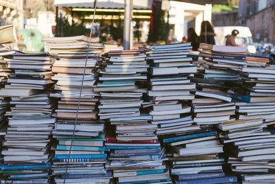 Stack of books for sale at market stall