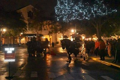 People walking on street at night