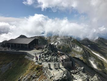 Panoramic view of building and mountains against sky