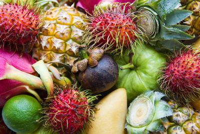 Fresh and ripe colorful fruits. dragon fruit, pineapple, lime, mango, rambutan, mangosteen, guava.