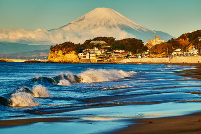 Scenic view of sea against blue sky