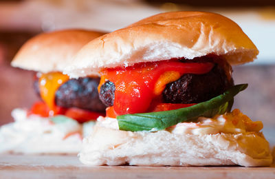 Close-up of burgers on table