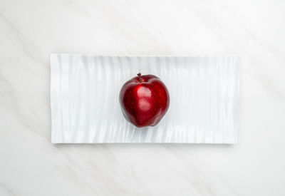 Directly above shot of red cherries on table