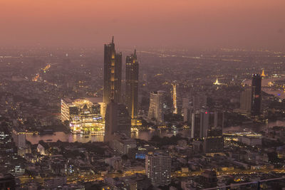 High angle view of illuminated buildings in city