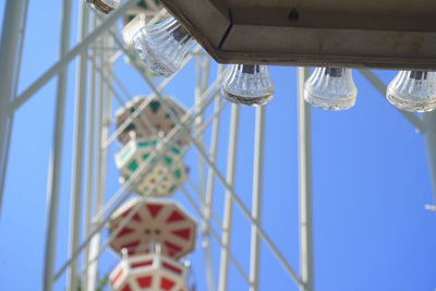 Low angle view of ferris wheel against sky