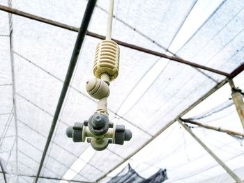 Low angle view of lighting equipment on ceiling