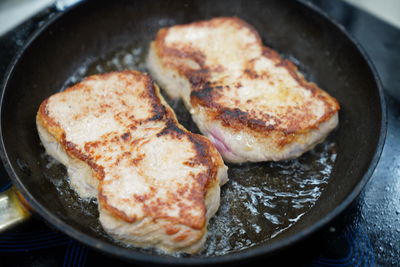 High angle view of meat in cooking pan