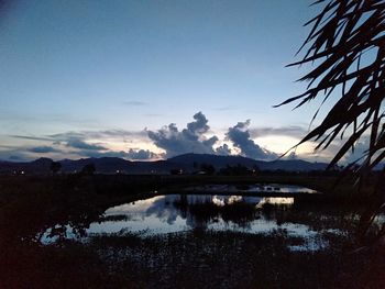 Scenic view of lake against sky during sunset