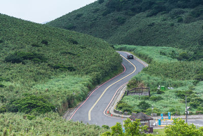 High angle view of car on road amidst trees