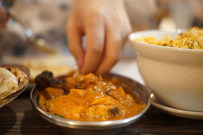 Close-up of person preparing food