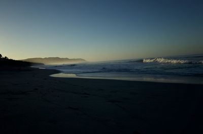 Scenic view of sea against clear sky during sunset