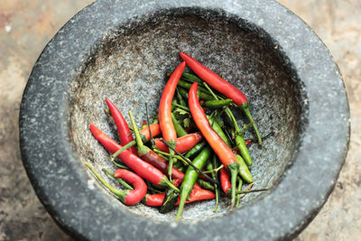 Close-up of chili peppers in mortar
