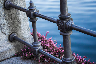 Close-up of railing against lake