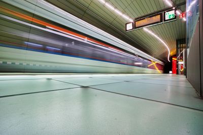 Blurred motion of train at railroad station