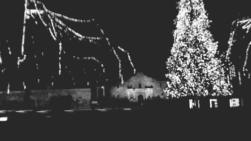 Low angle view of illuminated building at night