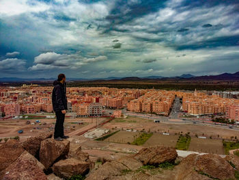 Man standing in front of old ruin